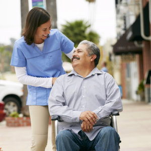 caregiver assisting old man