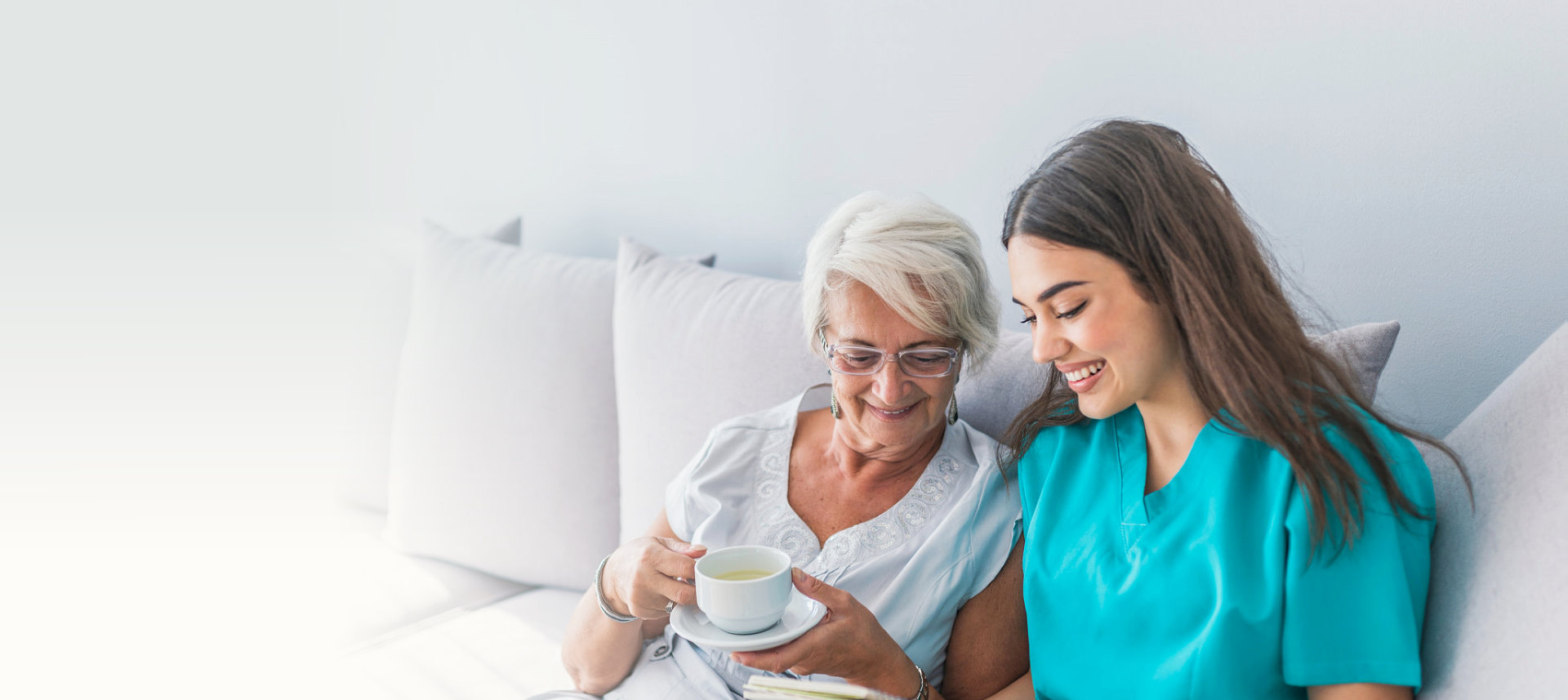 caregiver and old woman talking