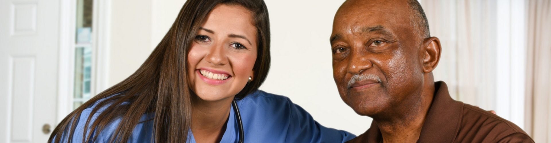 caregiver and old man smiling